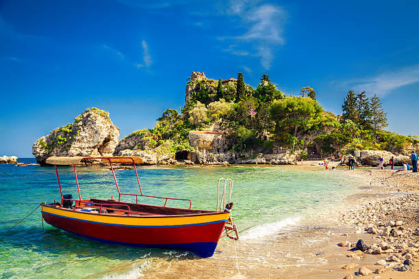 small boat for excursion small boat for excursion in front of the island Isola Bella at Taormina, Sicily sicily photos stock pictures, royalty-free photos & images