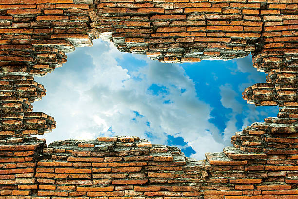 istock The old brick walls are broken and see the sky 473923778