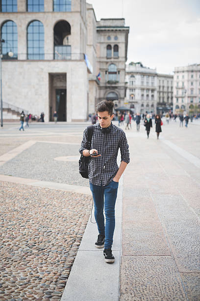 istock young handsome alternative dark model man in town 473926454