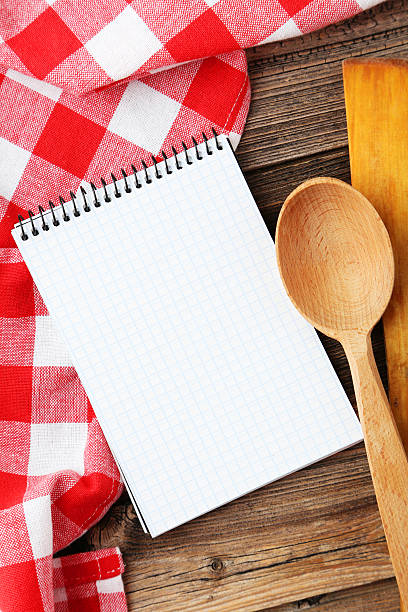 istock Open blank recipe book on brown wooden background 473929204
