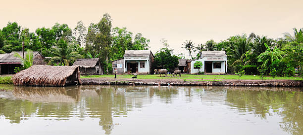 Dong Thap, Vietnam - July 7, 2013: Vietnamese people and their house in Mekong delta, Vietnam.
