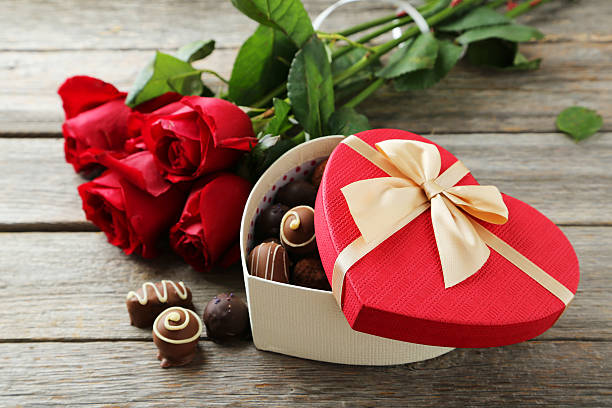istock Beautiful heart gift box on grey wooden background 473929956