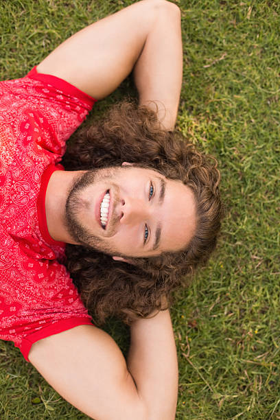 istock Handsome hipster in the park 473935844