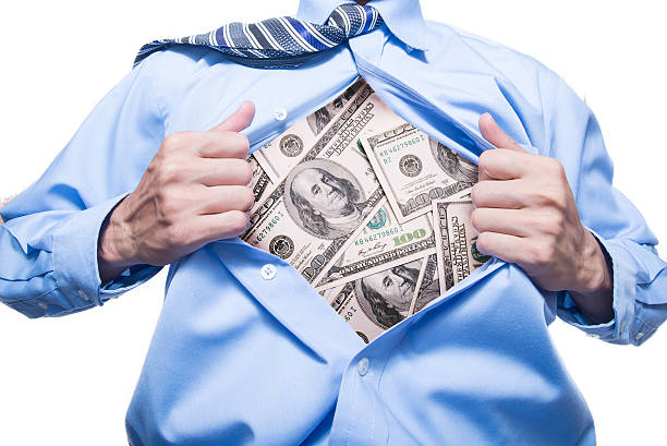 uomo d'affari, mostrando un dollaro nella sua camicia - embezzlement white collar crime stealing currency foto e immagini stock