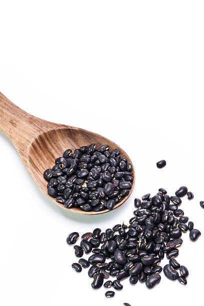 istock black beans in wooden spoon 473936758