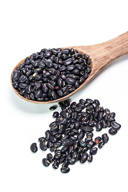 istock black beans in wooden spoon 473936762