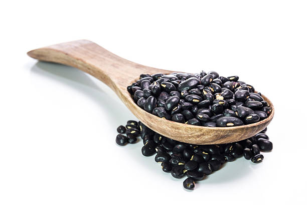 istock black beans in wooden spoon 473936876
