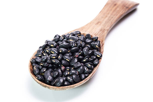 istock black beans in wooden spoon 473937374