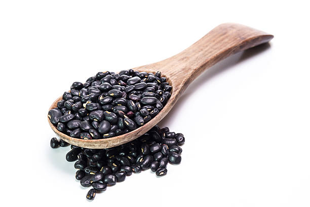 istock black beans in wooden spoon 473939622