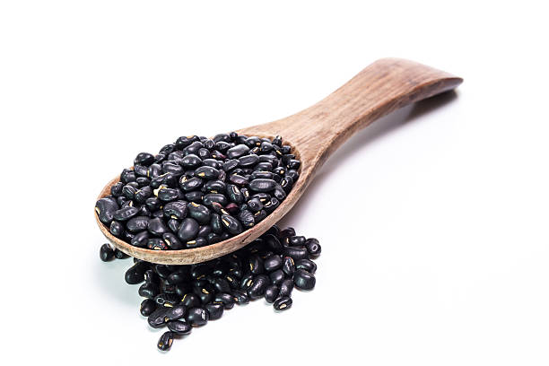 istock black beans in wooden spoon 473939624