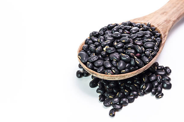 istock black beans in wooden spoon 473939626