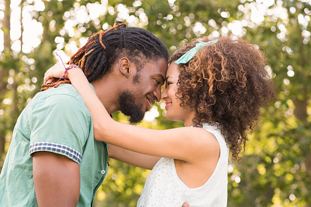 istock Black couple embracing in the park 473939790