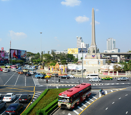 Bangkok, Thailand - February 4, 2015: Many vehicles at Victory Monument roundabout in Bangkok. The monument has been established in June 1941 to mark a victory in war with Frenchmen.