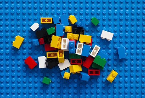 Tambov, Russian Federation - February 20, 2015: LEGO Blocks on blue baseplate. Studio shot.