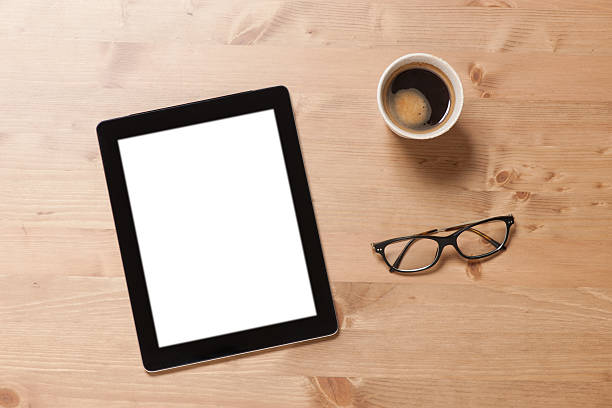 istock Blank white screen digital tablet on office desk 473940724