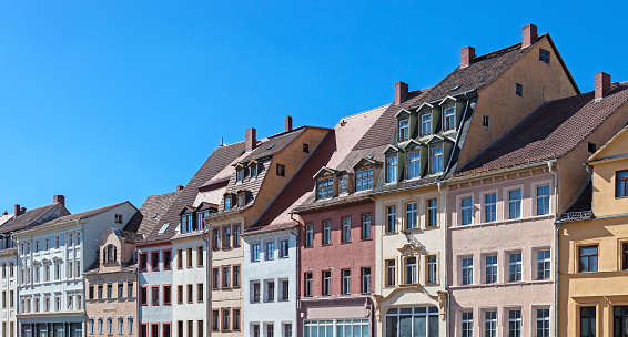 Facades and roofs of old houses at the market place of Altenburg (Thuringia, Germany). The market place is located in the old town with a lot of patrician and Gründerzeit style houses.