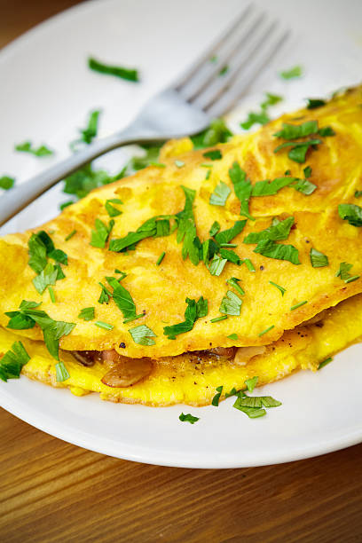 istock Delicious Egg Omelette with Greens and Cheese 473957172