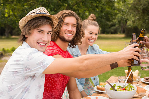 istock Happy friends in the park having lunch 473957878