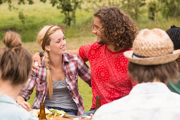 istock Happy friends in the park having lunch 473957972