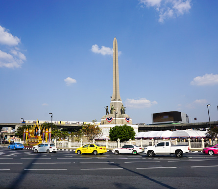 Bangkok, Thailand - February 4, 2015: Many vehicles at Victory Monument roundabout in Bangkok. The monument has been established in June 1941 to mark a victory in war with Frenchmen.