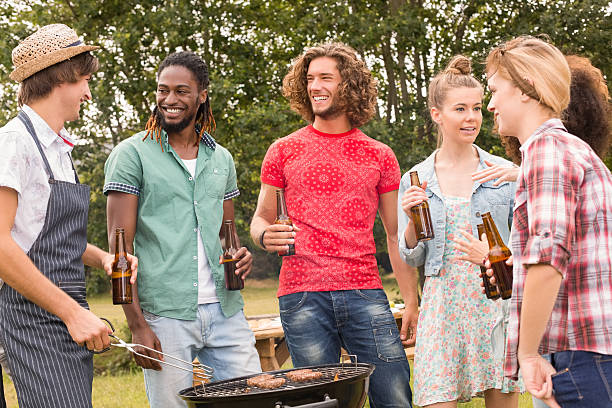istock Happy friends in the park having barbecue 473958108