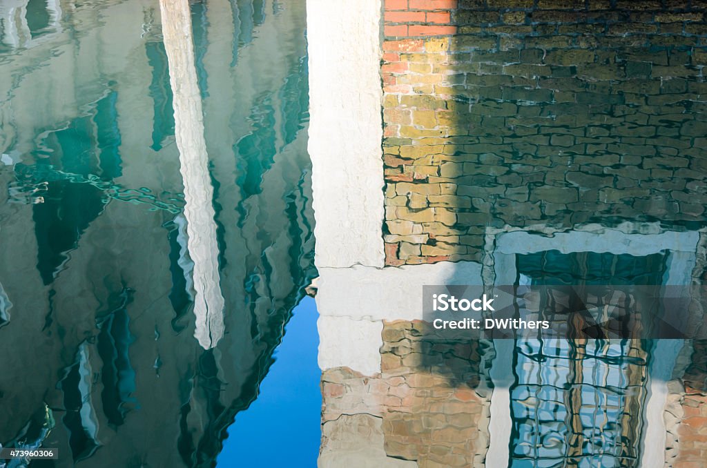 Venice Buildings Reflected in Canal Buildings reflected in the water of a Venetian canal. 2015 Stock Photo