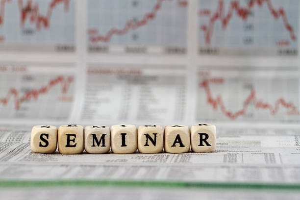 istock seminar word built with letter cubes on newspaper background 473961056