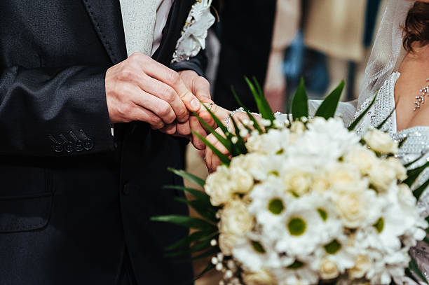 istock Wedding ceremony. Registry office. A newly-married couple signs the 473967430