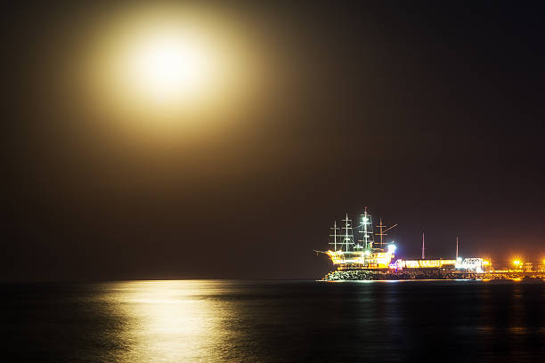 Moonrise view over Jeongdongjin and the famous yacht port off the coast. Taken in the summer after sunset. Gangneung, South Korea.