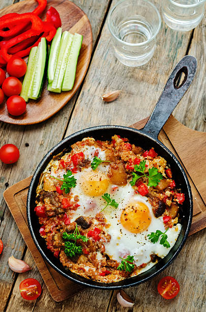 istock fried eggs with peppers, tomatoes, quinoa and mushrooms 473986824