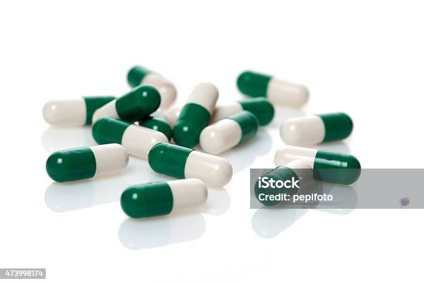 Greenwhite Capsules Stock Photo - Download Image Now - Capsule - Medicine, Green Color, White Color