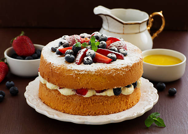 istock Genoise (cake) with cream, berries and lemon cream. 474008460