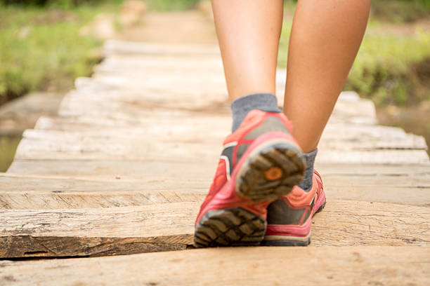 istock Close up on feet crossing bridge 474008652