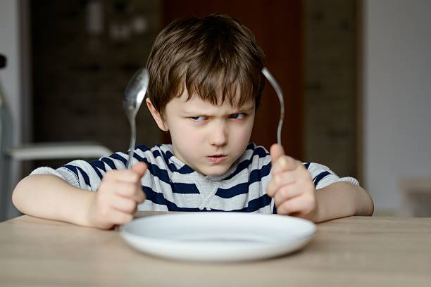 istock Upset little boy waiting for dinner 474008742