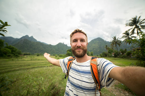 istock Beard man taking selfie in nature showing view 474009612