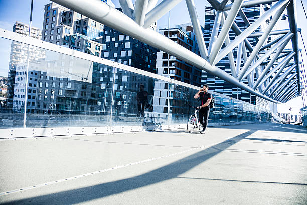 Commuter walking on a bridge in the morning