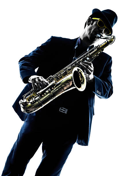 istock man saxophonist playing saxophone player  silhouette 474017216