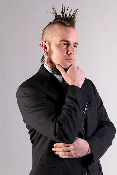 istock Non-comformist Businessman In Suit, Hand On Chin 474020134