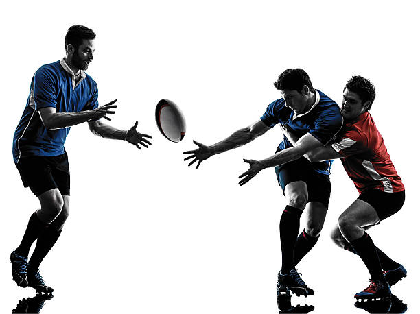 istock Low illuminated rugby men playing isolated on white 474020364