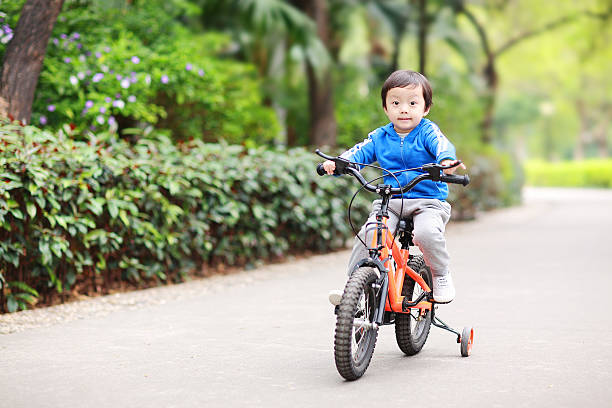 istock Children ride a bike 474031354