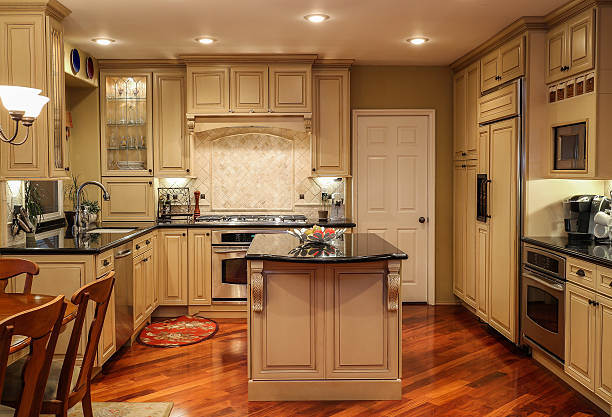 istock Kitchen wth oak wood cabinets island and granite countertops 474033492