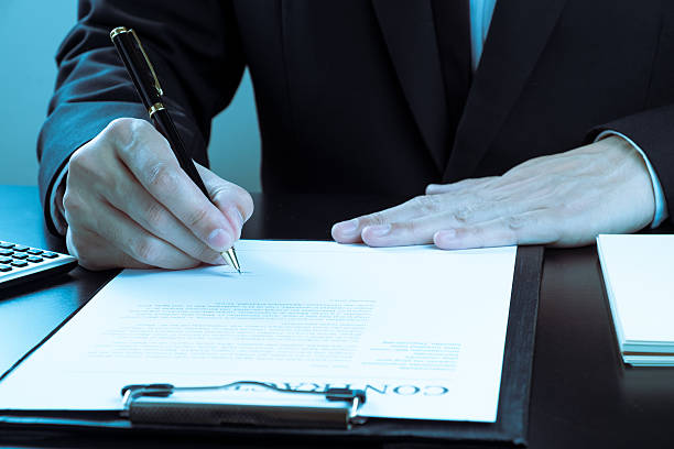 istock businessman signing marketing contract. 474036158