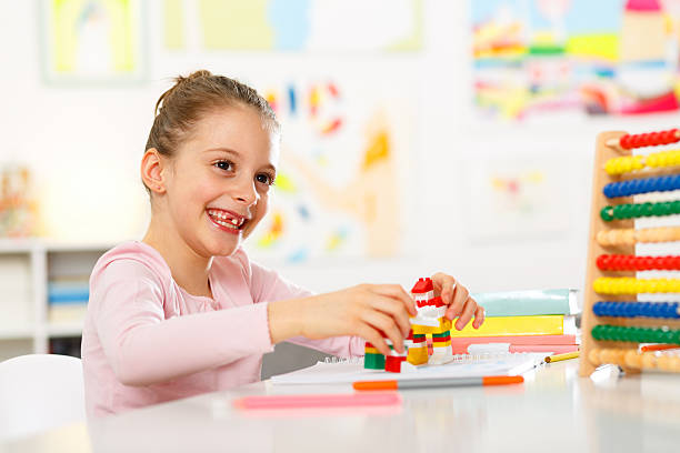 istock Little girl is doing homework at home 474036452