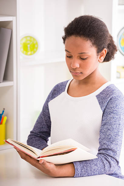 istock Schoolgirl at home 474036854
