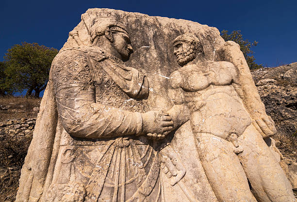 istock King Mithridates shaking hands with god Herakles 474038020