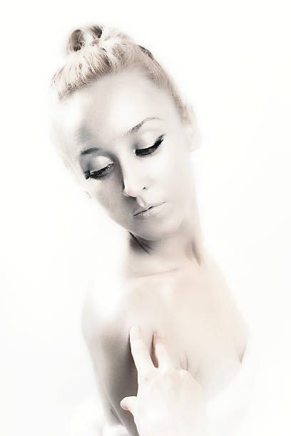 istock beautiful young blond woman with shiny silver makeup 474038429