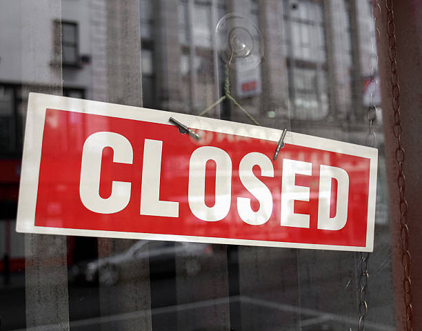 istock Red and white closed sign hanging in a shop window 474039256