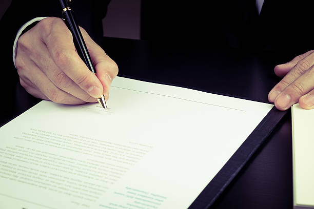 istock businessman signing marketing contract. 474042558