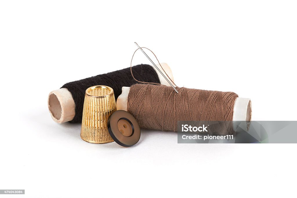 thread thread, needle, button and thimble on isolate white  background 2015 Stock Photo