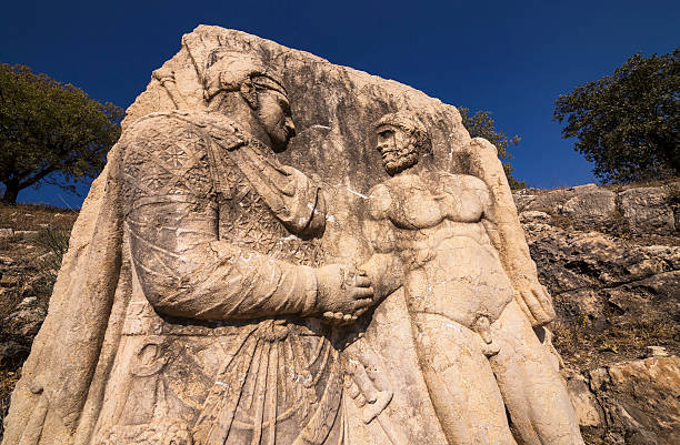 istock King Mithridates shaking hands with god Herakles 474043914